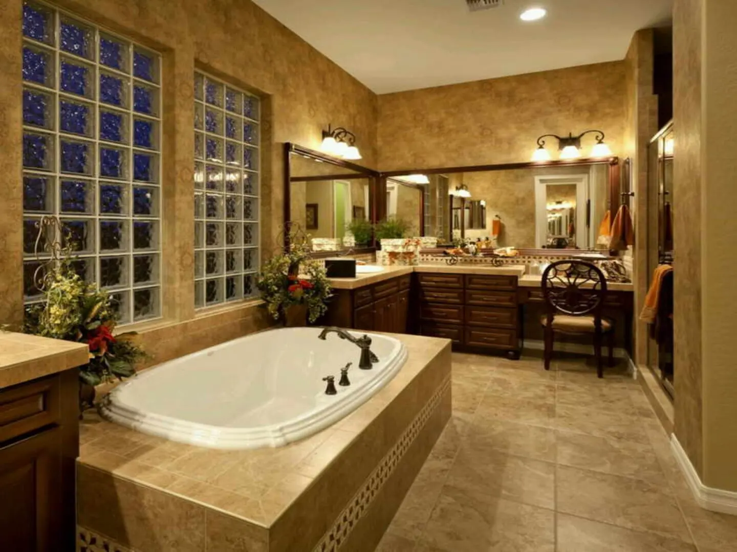 A bathroom with a large tub and sink.